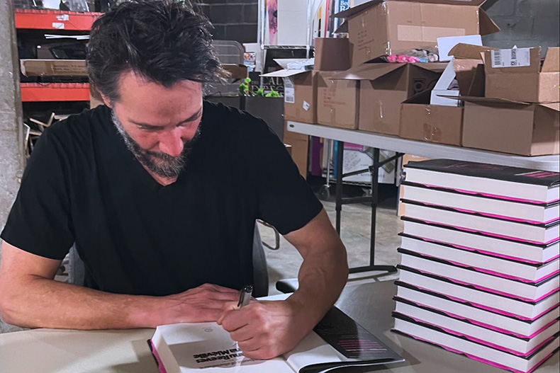 Keanu Reeves signing books at Rainy Day Books