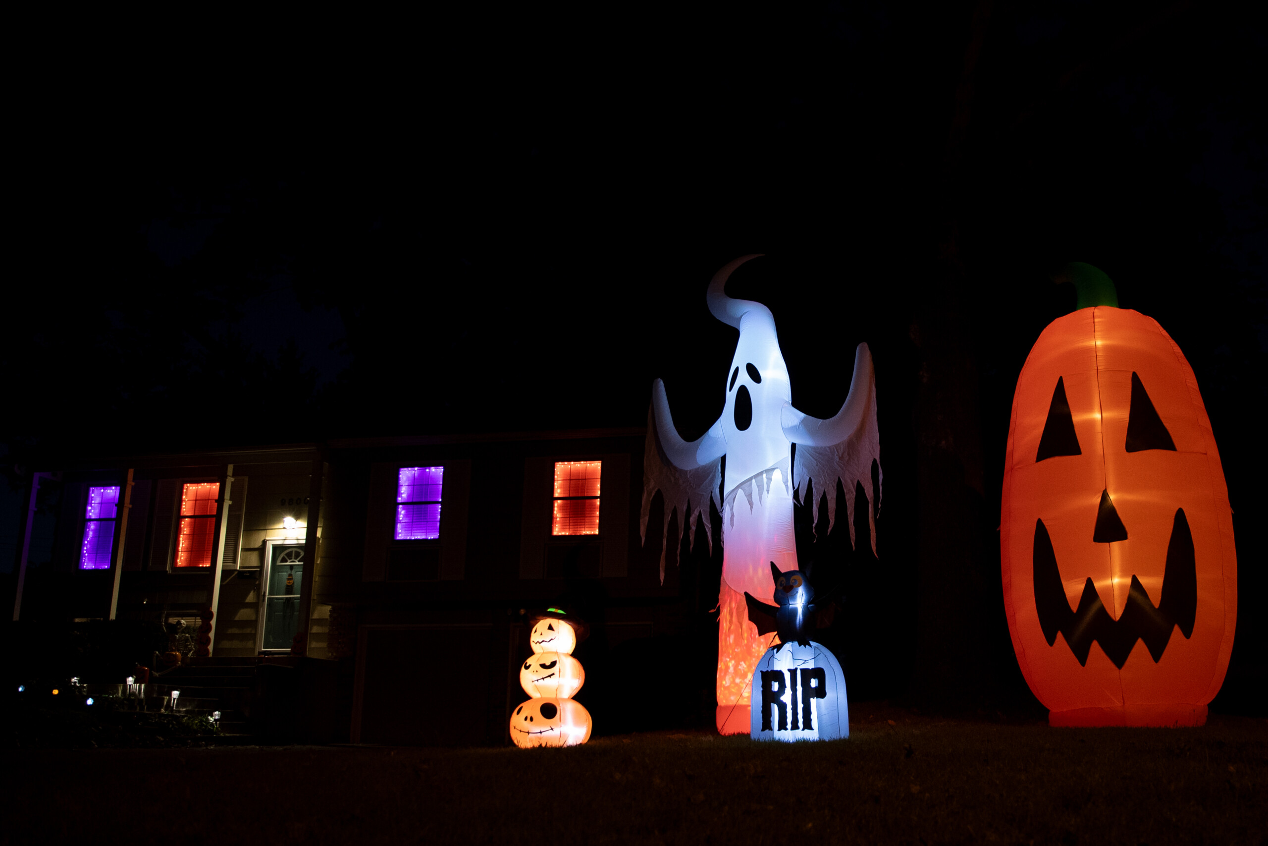 Large inflatables glow outside of a house off of Farley Street and West 88th Terrace in Overland Park.