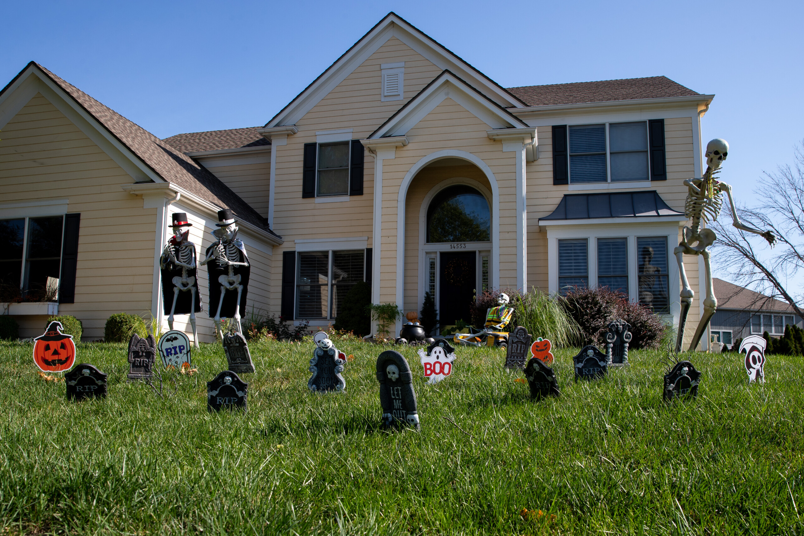 Gravestones and giant skeletons outside of a home on Windsor Drive and West 145th Sreet in Leawood.