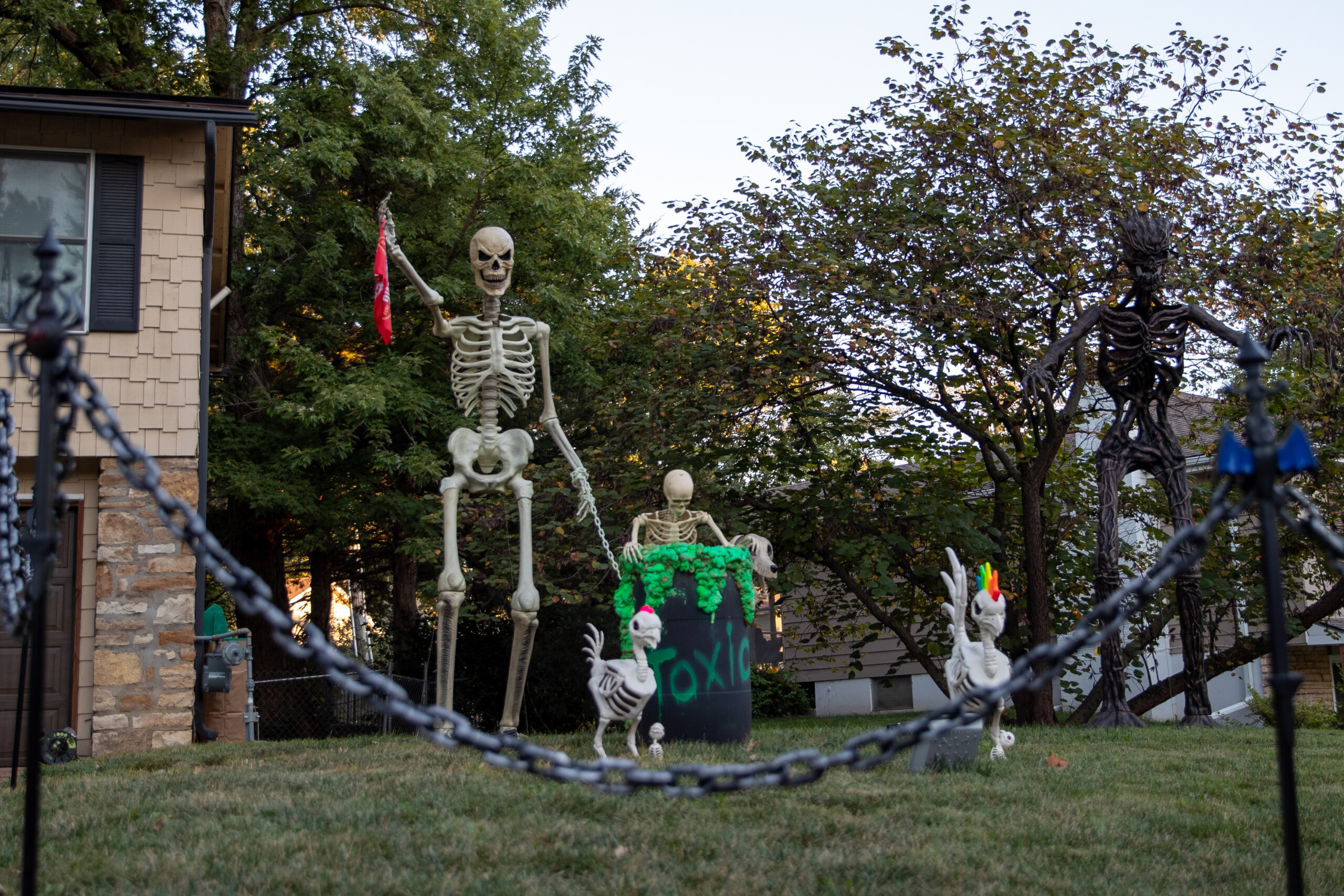Skeletons and a toxic container guard a home on the corner of Switzer Road and Mastin Drive in Overland Park.