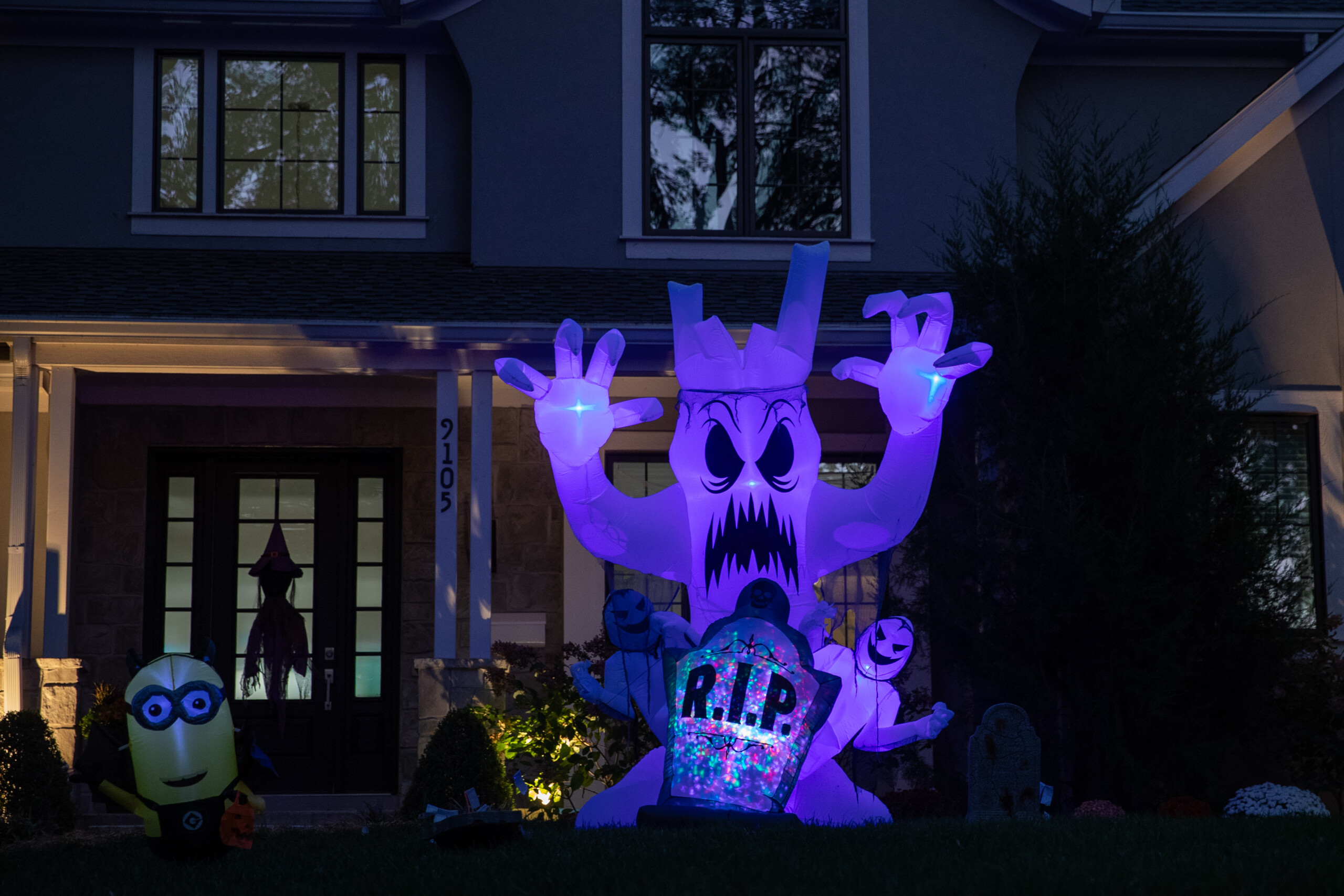 Glowing inflatables outside of a home on Ensley Lane by West 91st Street in Overland Park.