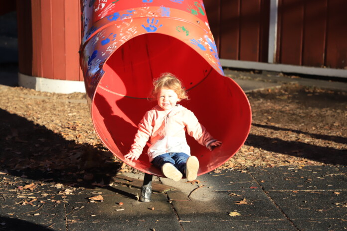 Kids (and a few adults) took one last slide on the red barn tube slides at Deanna Rose Children's Farmstead Thursday as the season came to a close. Next season, new playground equipment will take the place of the slides at the barn.