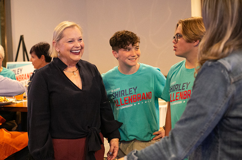 Shirley Allenbrand (left) at her watch party at a golf club in Olathe.