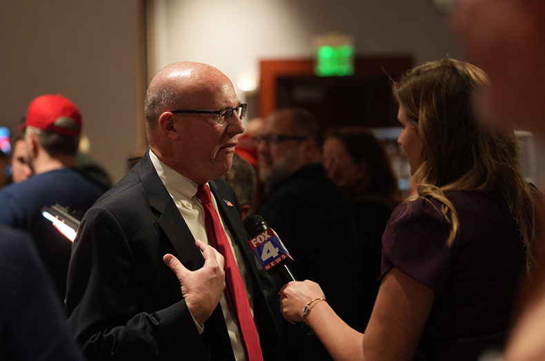 Steve Howe (left) speaks to Fox 4 News at the Johnson County Republican Party's watch party.