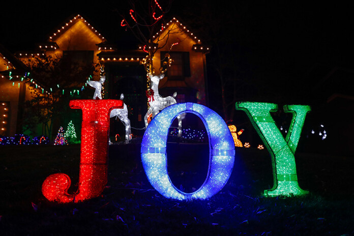 Lights reading “Joy” outside of a home in the “Christmas Place” neighborhood at West 131st Place and Antioch Road in Overland Park.