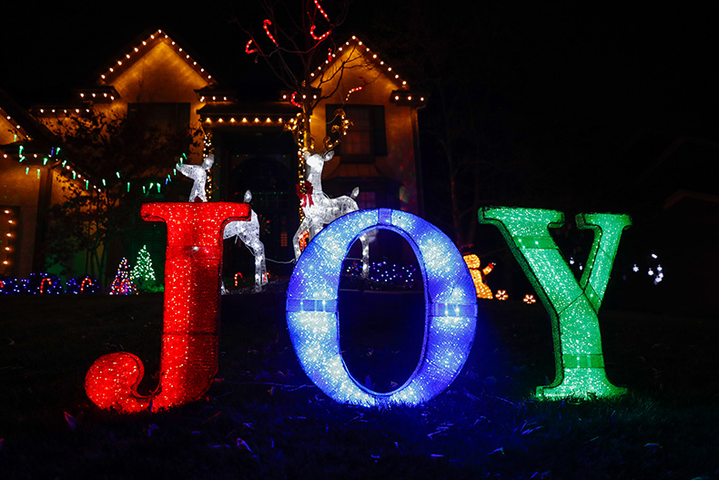 Lights reading “Joy” outside of a home in the “Christmas Place” neighborhood at West 131st Place and Antioch Road in Overland Park.
