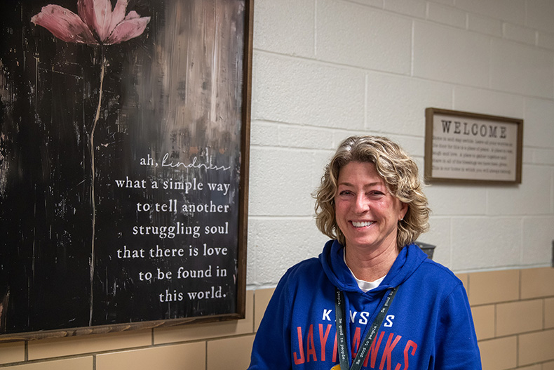 Project 1020 co-founder Barb McEver stands by her favorite piece of artwork at the shelter.