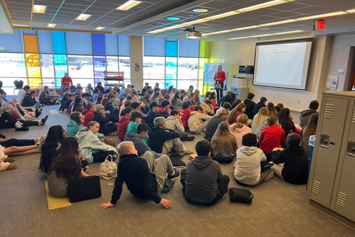 Students at Aubry Bend Middle learn about enrollment for the 2025-26 school year.