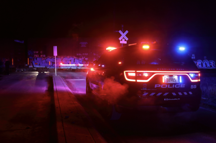 A police car at the train crossing near 151st and Kenneth where there was a collision between a vehicle and train Monday night.