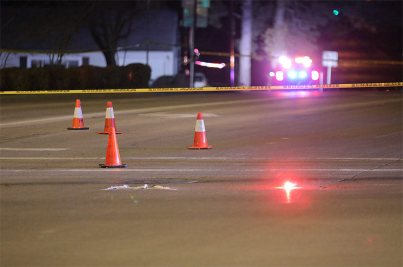 Evidence marked with traffic cones on 75th Street near where an attempted carjacking took place. 