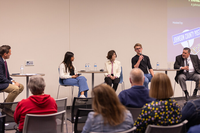 Johnson County students and Tim DeWeese (left) with the Johnson County Mental Health Center talk about phones in schools at the Post's town hall Tuesday night.