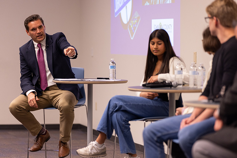 Kyle Palmer, editor of the Johnson County Post, moderated the panel discussions at the town hall.