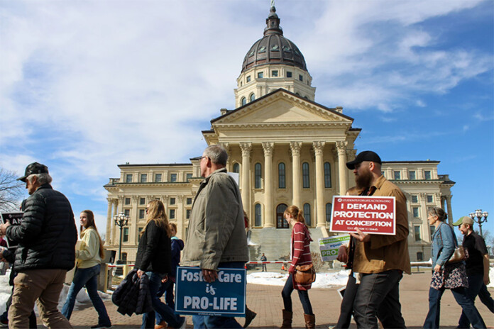 Anti-abortion protestors rally outside the Kansas Statehouse in Topeka during the 2025 March for Life.