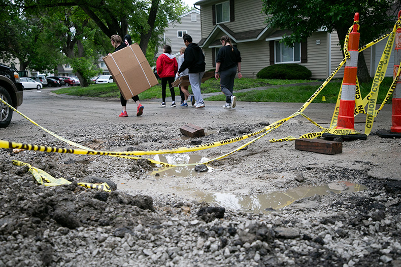 A muddy pit remains where a Fire District# 1 fire truck sank into the street Sunday night, crushing the main water line to the complex and leaving residents without water.