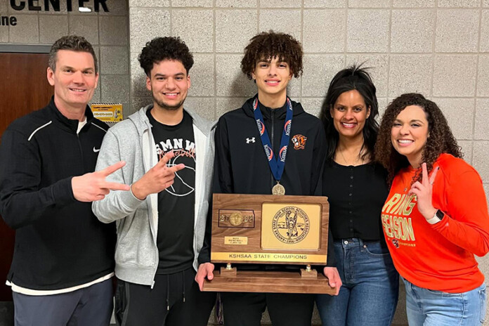 Shawnee Mission Northwest basketball player Keaton Wagler (center), was on the state championship team this spring.
