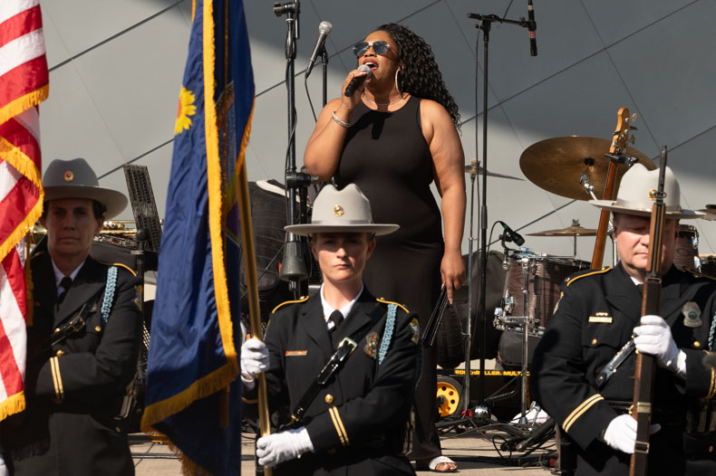 Piaget Long performs the national anthem, flanked by the Johnson County Sheriff’s Department color guard. Originally from St. Louis, Long has performed throughout the jazz district in Kansas City for over a decade.