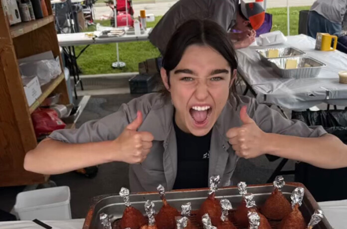 Caught Smokin’ competitor and 2025 graduate Lucy Hutton shows off the team’s chicken lollipops dish. Hutton will attend the Culinary Institute of America in New York City in the fall on a full ride scholarship.