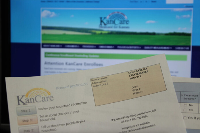 Renewal paperwork for KanCare, the Medicaid program in Kansas. Proposed federal budget cuts could lead to 13,000 Kansans losing coverage.