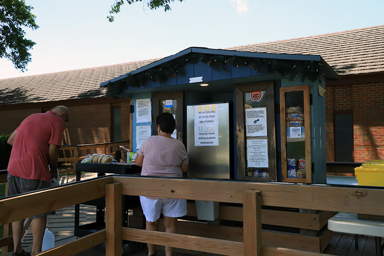 The Tiny Pantry Times food pantry in front of Overland Park Christian Church is restocked on a Sunday afternoon.
