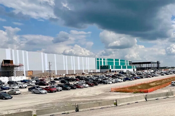 The Panasonic electric vehicle battery manufacturing plant in DeSoto, Kansas. Experts say the plant could delay hiring while it waits out economic uncertainty.