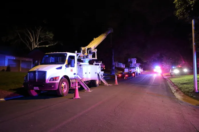 Four trucks from PAR Electrical Contractors were parked in the 7500 block of Norwood Street in Prairie Village. On the street is an emergency vehicle Johnson County Med-Act, and parkied in a driveway is Prairie Village Police.