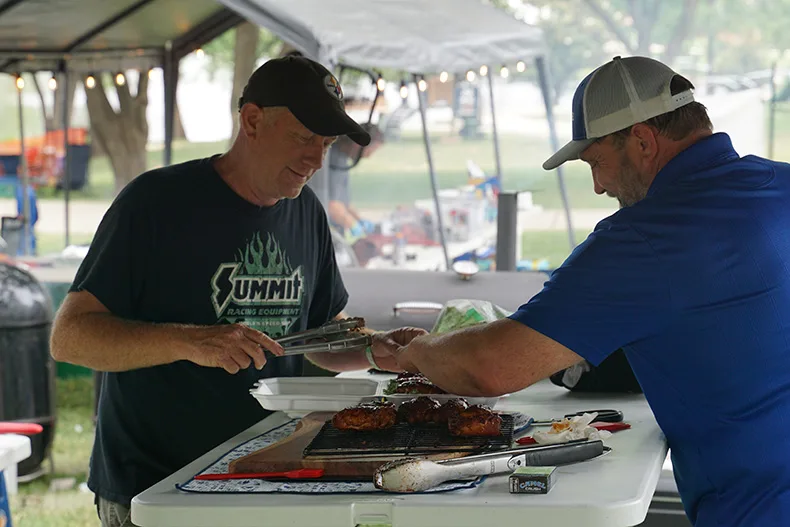 After their meat is determined to be up to par, cooks plate it for the judges. Photo credit Andrew Gaug.