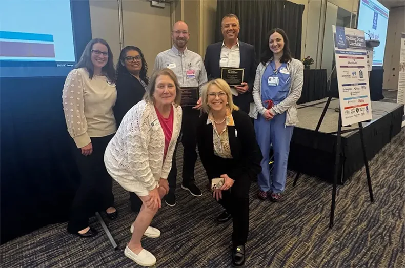 Staff with Overland Park Regional Medical Center and Kansas City Women's Clinic accepted the award during the Health Partnership Clinic's annual fundraising luncheon in April.