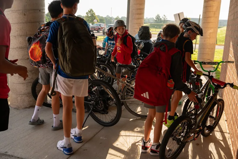Students at California Trail Middle School store their bikes before heading inside. So many students biked in groups to school that the rack was overflowing.