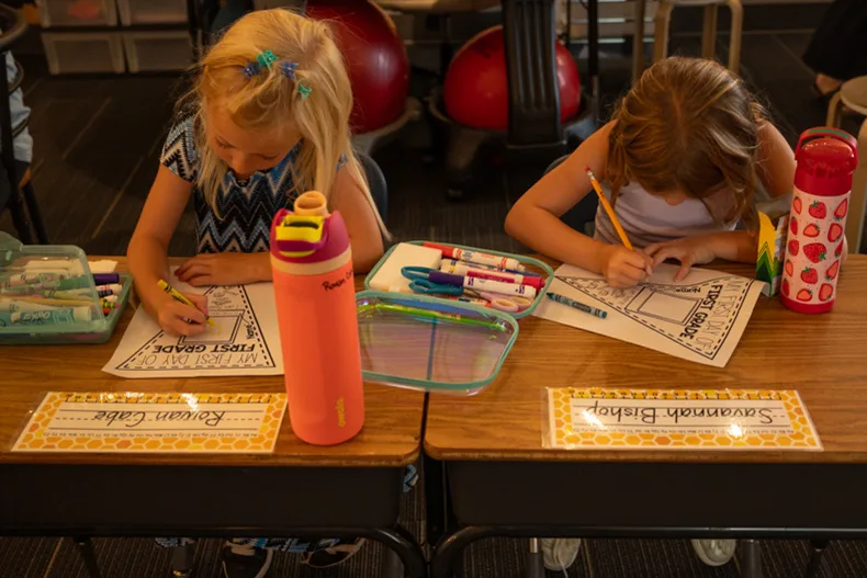 Students in Josie Harred’s first grade class at Bentwood Elementary draw pictures of themselves and their feelings at the start of first grade.