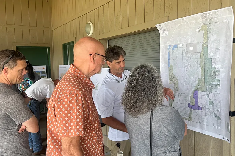 Jim Wilson, a project manager for the Greater Kill Creek Area Park Master Plan, listens to feedback on trail improvements from residents at the open house on Saturday at Kill Creek Park Beach House.