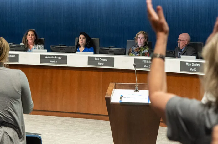 Lenexa City Council member Melanie Arroyo receives a standing ovation after revealing during the Aug. 5, 2025, council meeting that city police investigated her citizenship status and required her to prove her citizenship.