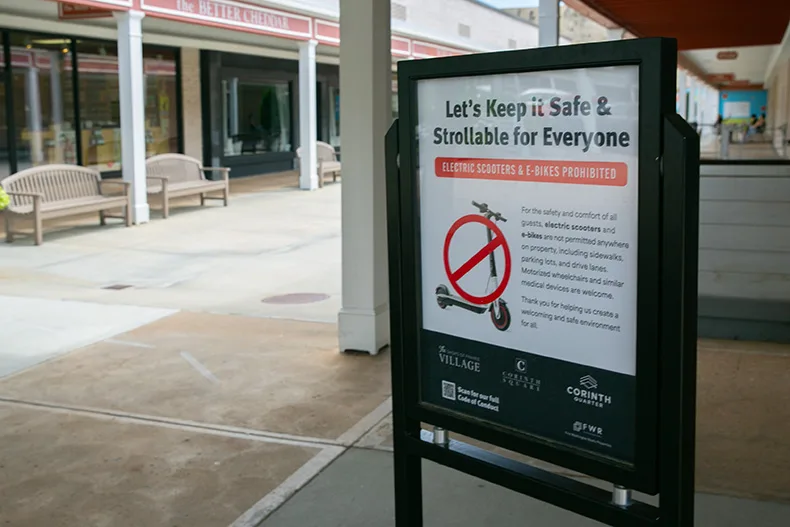 A sign at the Shops of Prairie Village banning e-bikes and e-scooters.