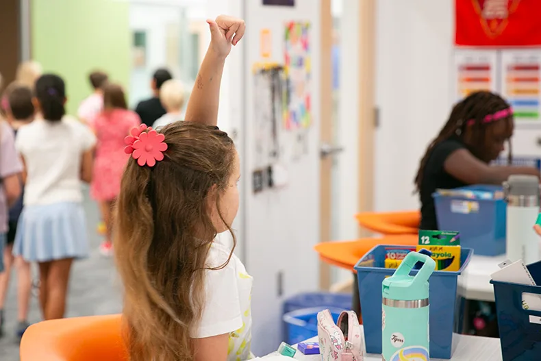 Student gives teacher a "thumbs up"