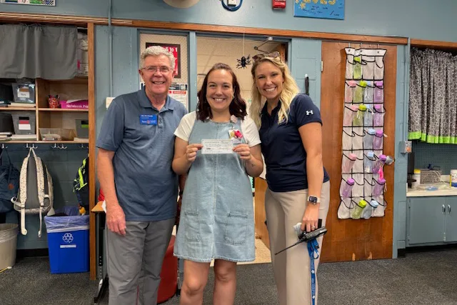From left, Bill McCollom, President of the Lenexa Rotary Foundation; Becca Smysor, 5th grade teacher and Rocket Cart leader; and Samantha Luchgel, principal of Rosehill Elementary.