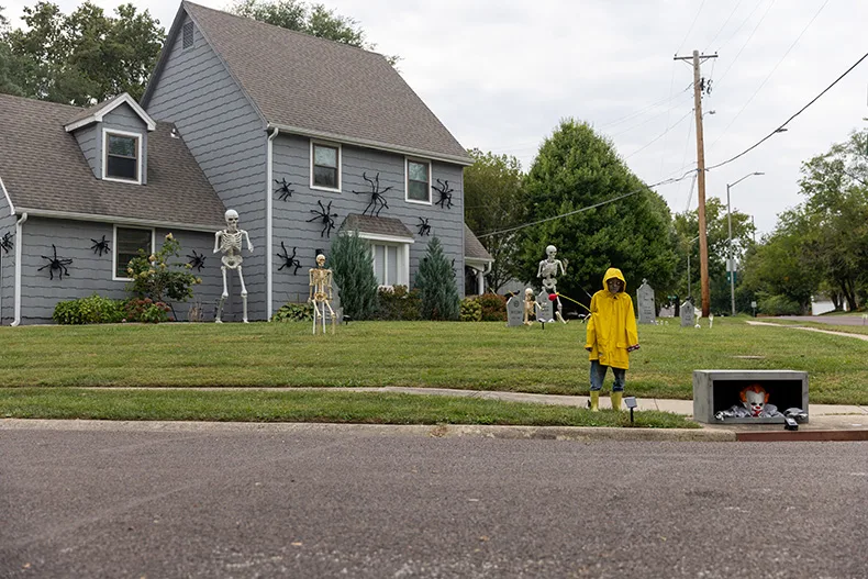 A home on the corner of West 91st Street and Belair Circuit in Overland Park features skeletons, spiders, Georgie and Pennywise the clown from the movie “It.”