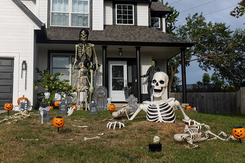 Skeletons grow out of a yard in the cul-de-sac off of South Greenwood and West 129th Terrace in Olathe.