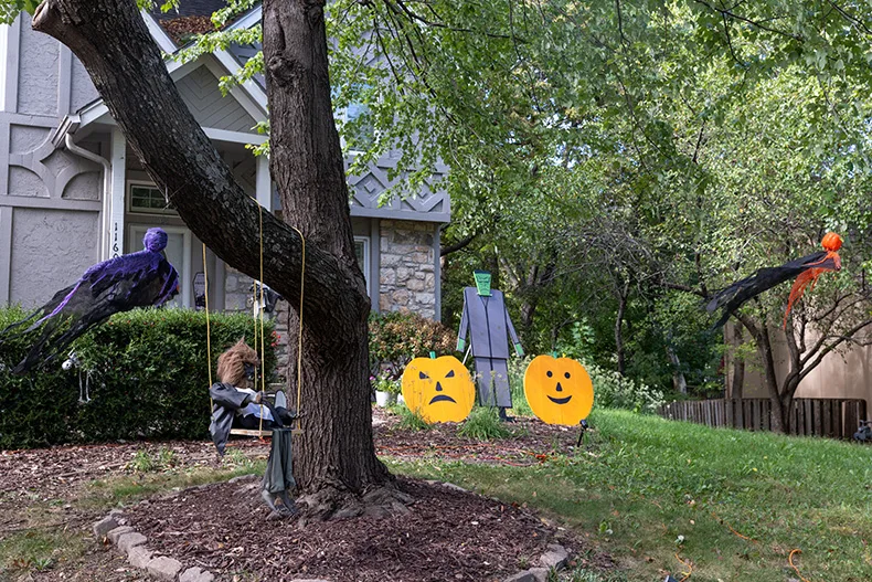 Ghosts hang from trees outside of a home near Hemlock Street and West 116th Street in Overland Park.