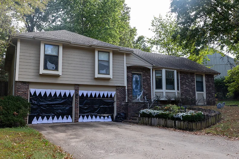 A garage is transformed into a monster at the corner of Hemlock Street and West 116th Street in Overland Park.