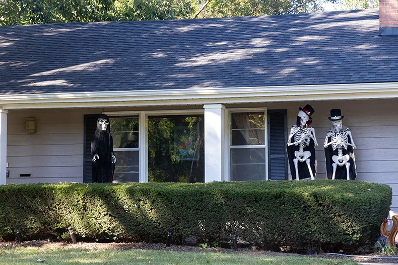 Skeletons play instruments on the porch of a home on the corner of Roe Avenue and West 66th Terrace in Prairie Village.