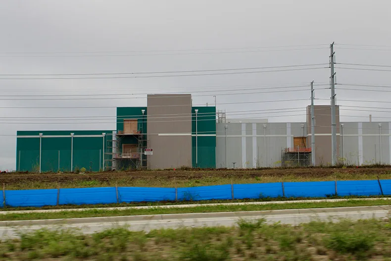 Panasonic officials say it is difficult to say when the plant will reach full production because there are many factors in play.