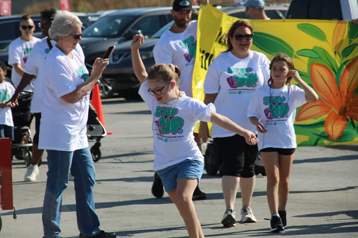 A girl enjoys the 30th Annual Step Up for Down Syndrome Walk in early October.