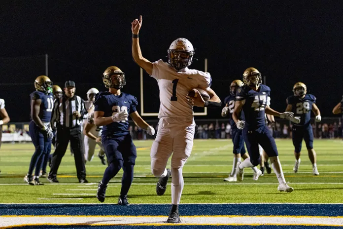 Mill Valley’s Blake Jay scores a touchdown during the game against Saint Thomas Aquinas on Friday, Nov. 7, at Saint Thomas Aquinas High School.