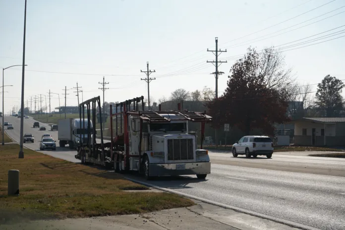 Traffic moves along a busy street.