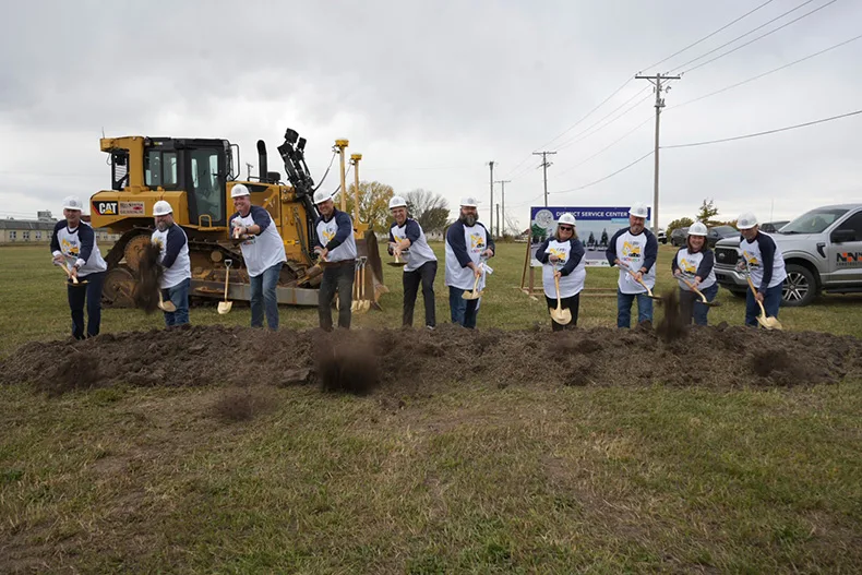 District officials take the first scoops of dirt out of the ground at the site of Gardner Edgerton School District’s new service center, on the corner of Warren and Poplar streets.