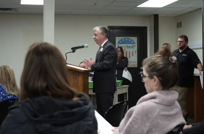 Election Commissioner Fred Sherman gives his initial report of the 2025 election results, including provisional ballots, at a Wednesday morning meeting before the county board.