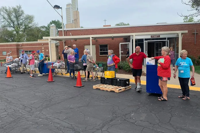 Mission Community Food Pantry volunteers at an April 2025 distribution day, celebrating National Superhero Day.