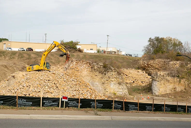 Crews demolish the stone pillars at The Rocks site in November 2025. 