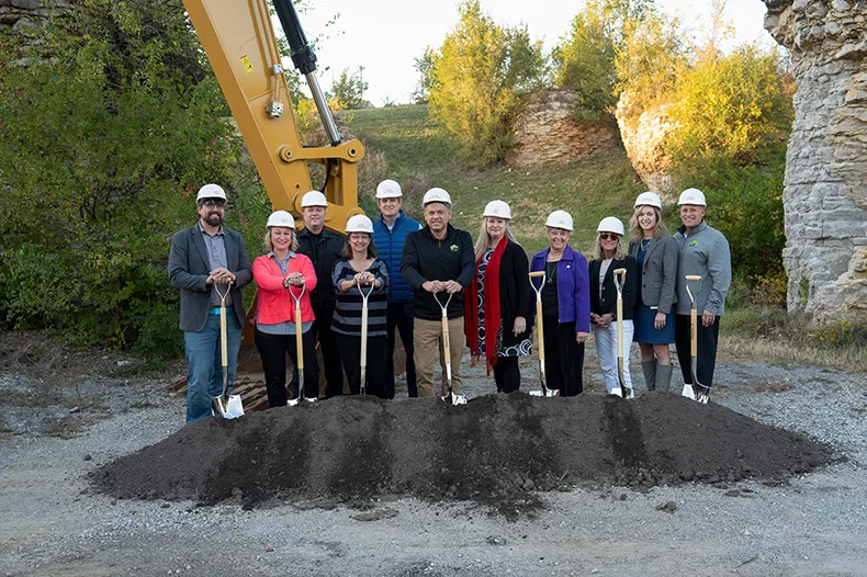 Roeland Park governing body members, city staff and the police chief celebrate the ground breaking of The Rocks redevelopment. Photo credit Danny Wastler.