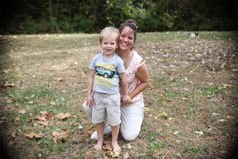Esther Reddish-Hanner poses with her son.