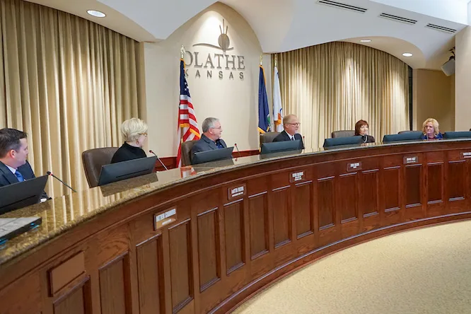 Members of the Olathe City Council sitting at the dais in Olathe City Hall.